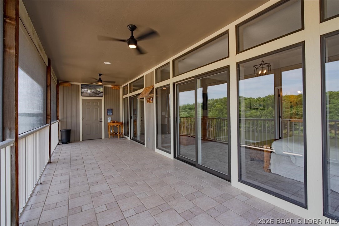 611 Lazy Days Road, Unit R7 Osage Beach, MO 65065 - Photo 25 of 38 Tiled screened Lanai for morning coffee and evenin