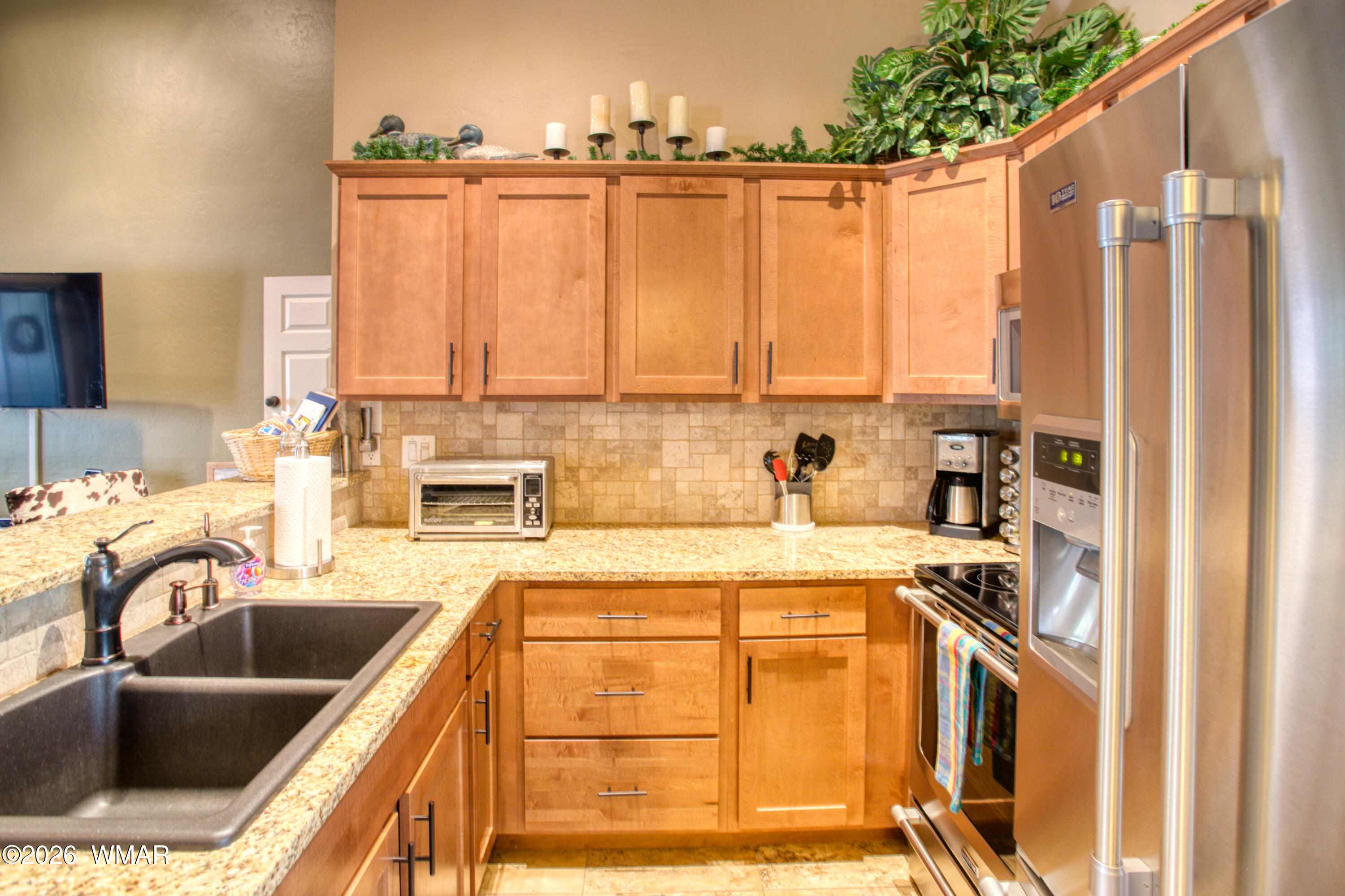 4568 Resort Loop, Unit 25A Pinetop, AZ 85935 - Photo 12 of 28 a kitchen with stainless steel appliances a sink a stove and a refrigerator