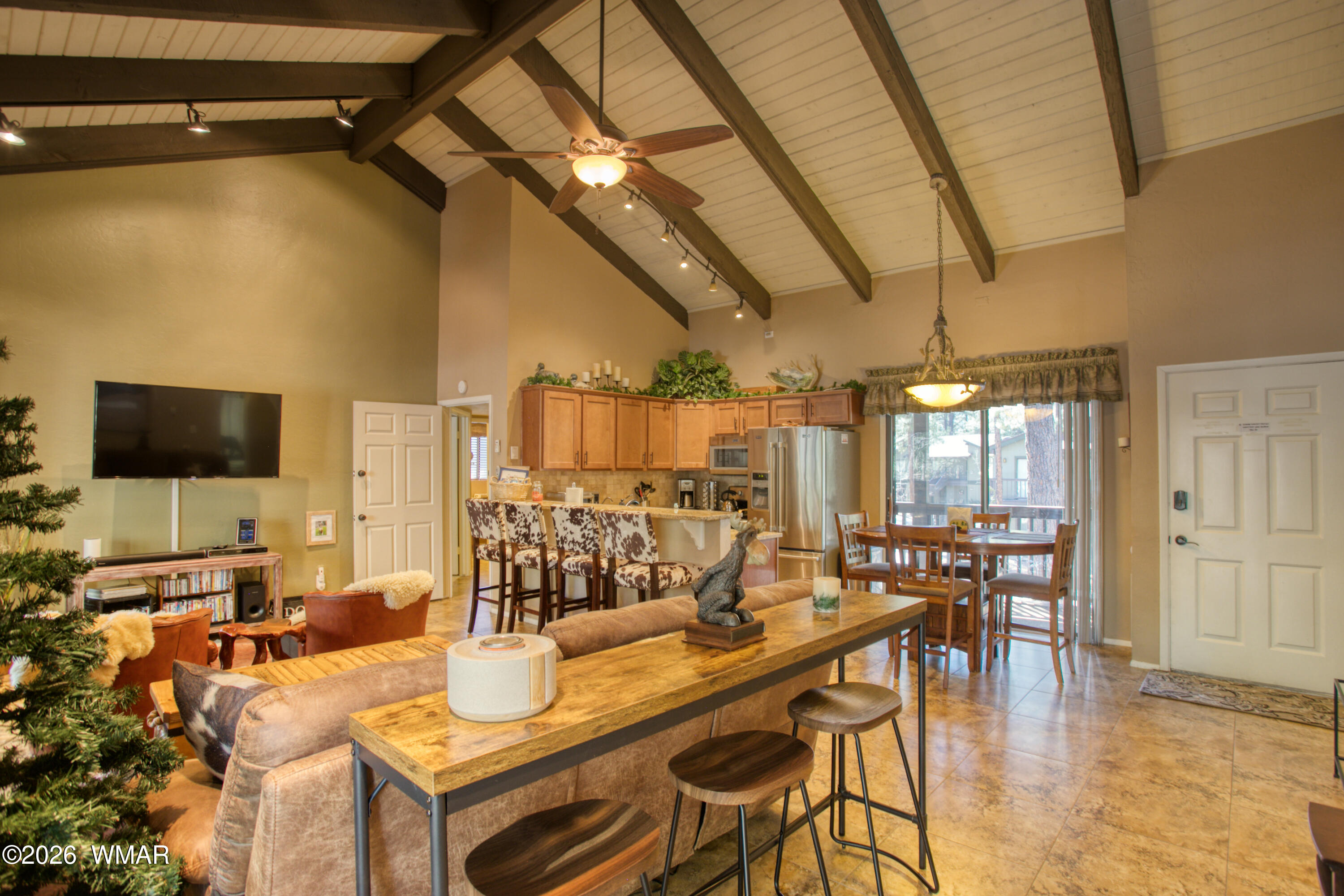 4568 Resort Loop, Unit 25A Pinetop, AZ 85935 - Photo 8 of 28 a view of a dining room with furniture window and wooden floor