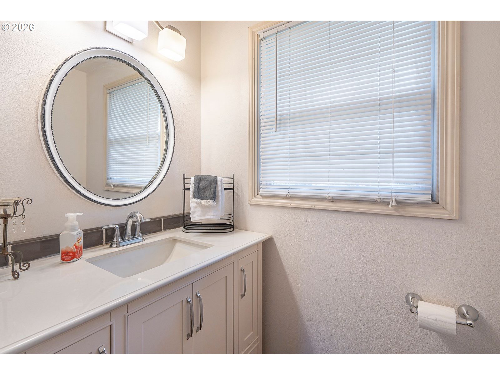 5356 Verda Lane Northeast Keizer, OR 97303 - Photo 18 of 41 a bathroom with a sink a mirror and a toilet