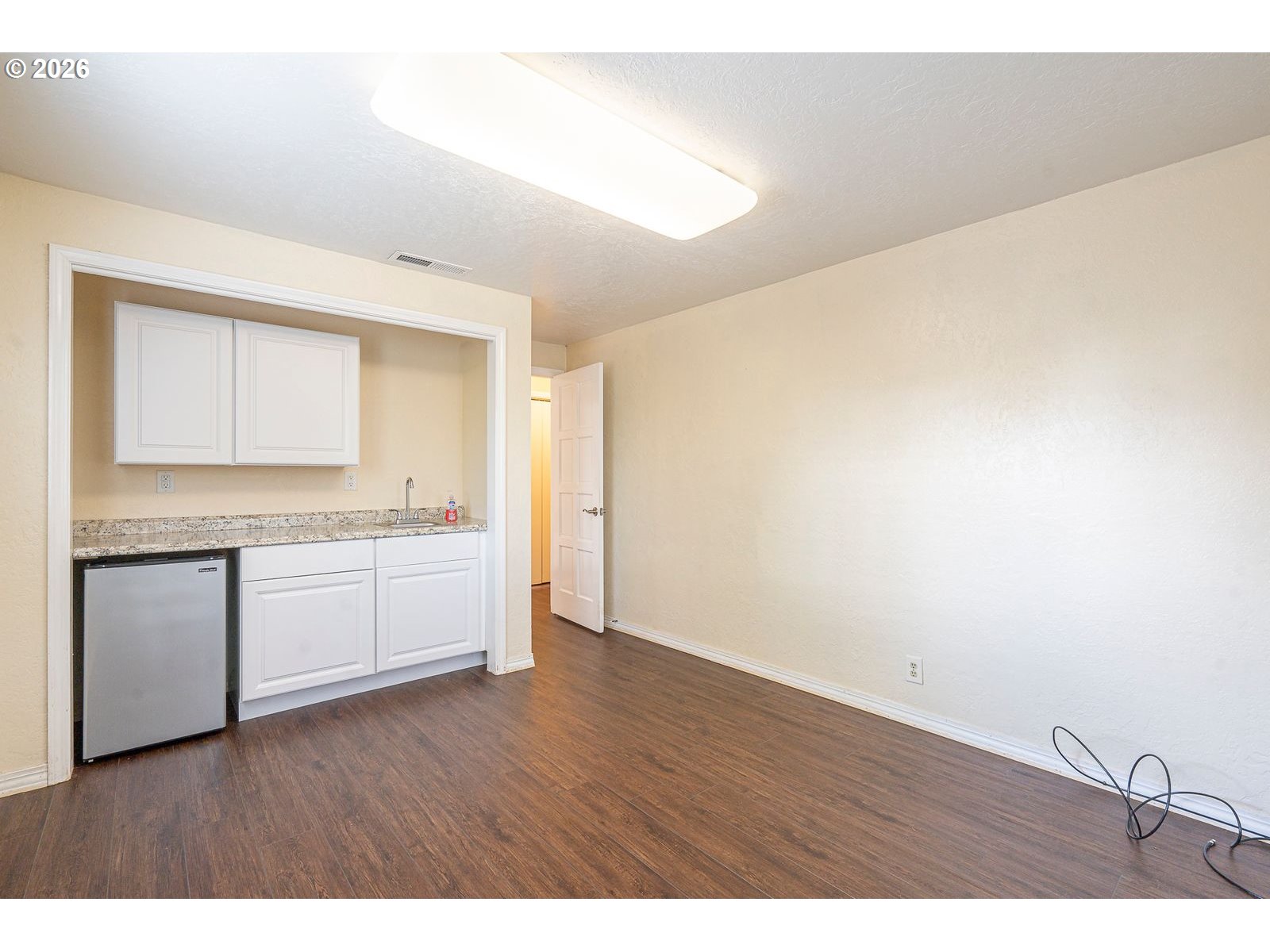5356 Verda Lane Northeast Keizer, OR 97303 - Photo 20 of 41 a view of a kitchen with a sink and dishwasher with wooden floor