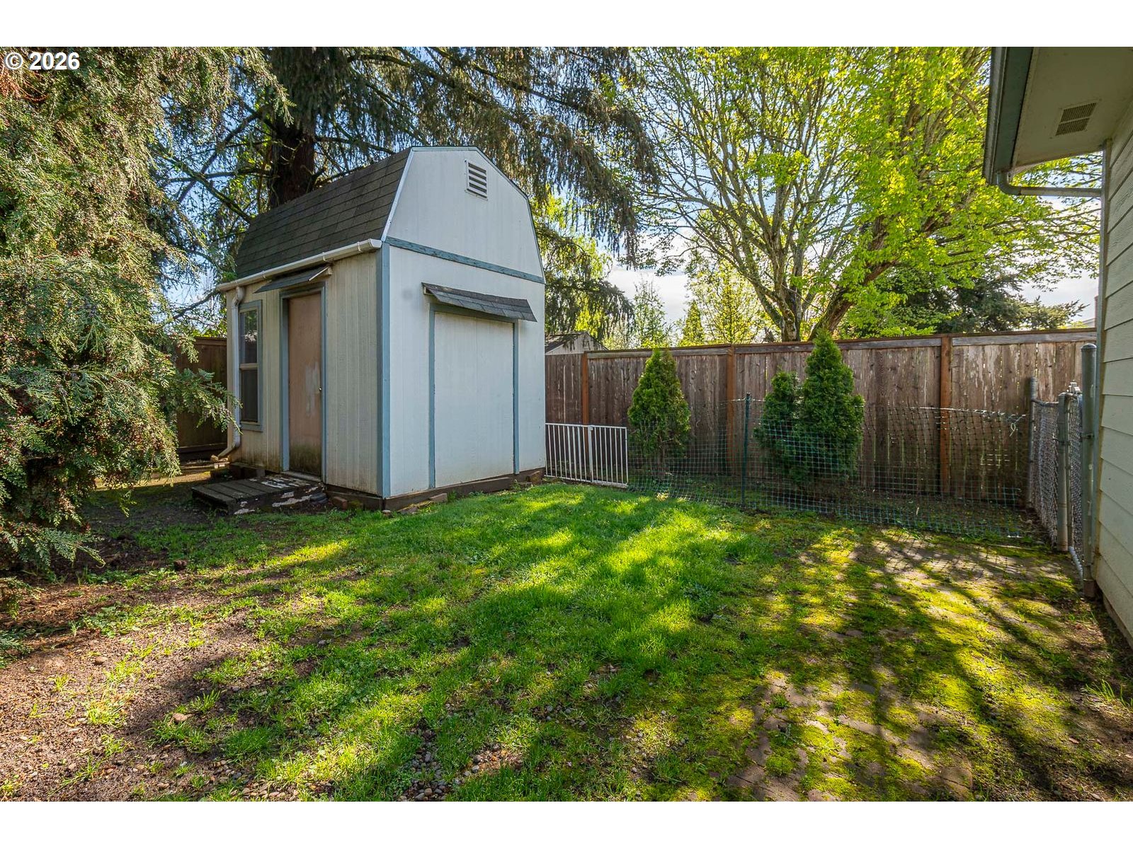 5356 Verda Lane Northeast Keizer, OR 97303 - Photo 41 of 41 a view of backyard with potted plants and wooden fence