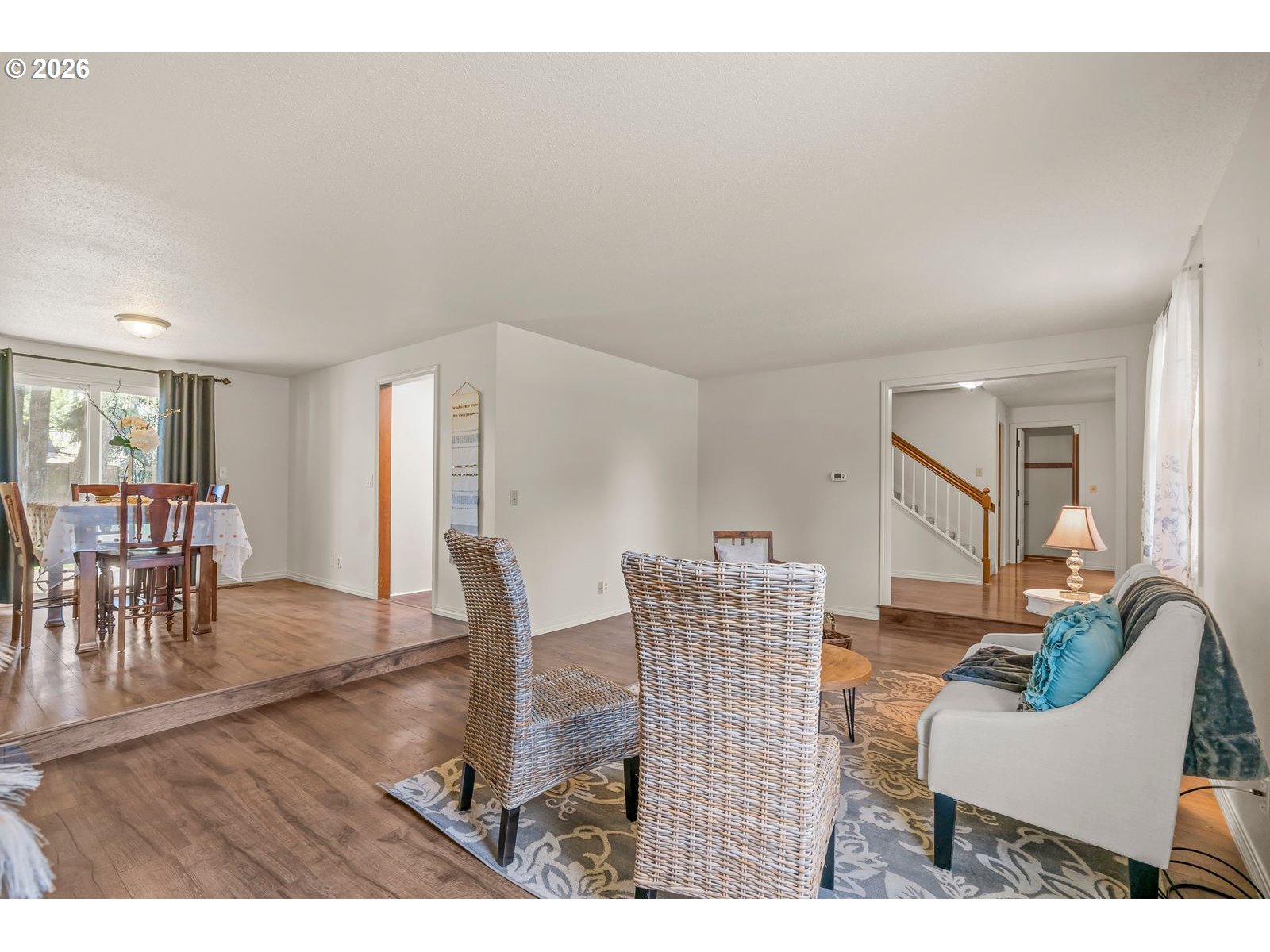5356 Verda Lane Northeast Keizer, OR 97303 - Photo 7 of 41 a living room with furniture and a dining table with wooden floor