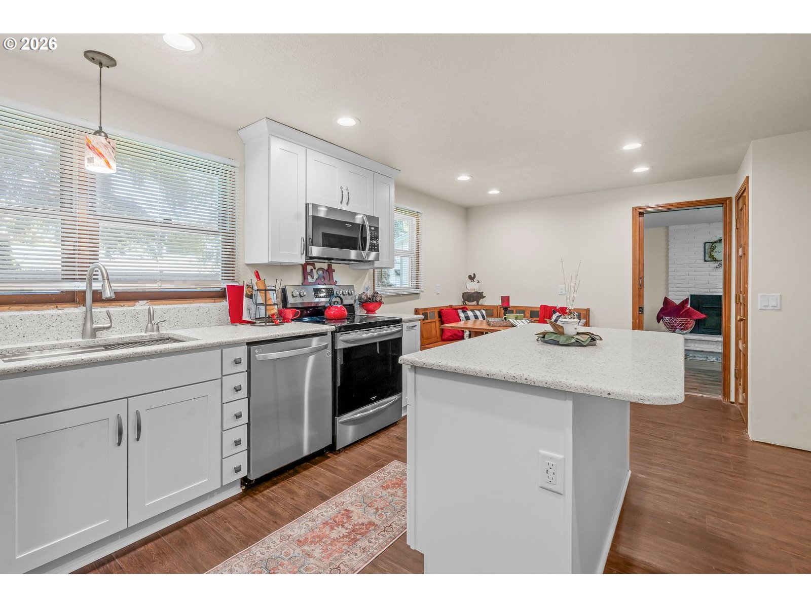 5356 Verda Lane Northeast Keizer, OR 97303 - Photo 10 of 41 a kitchen with granite countertop white cabinets and sink