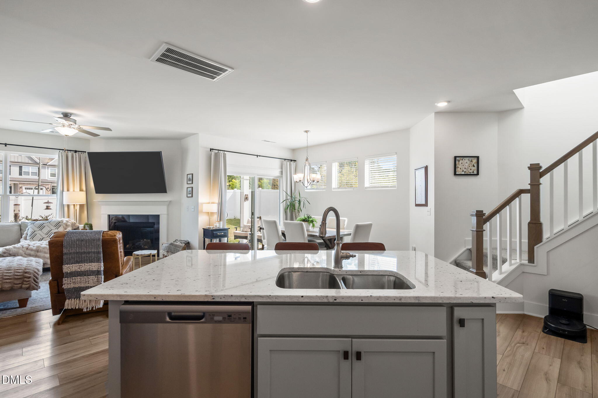 1000 Heartstone Way Durham, NC 27713 - Photo 13 of 43 a kitchen with a sink a counter space and a living room
