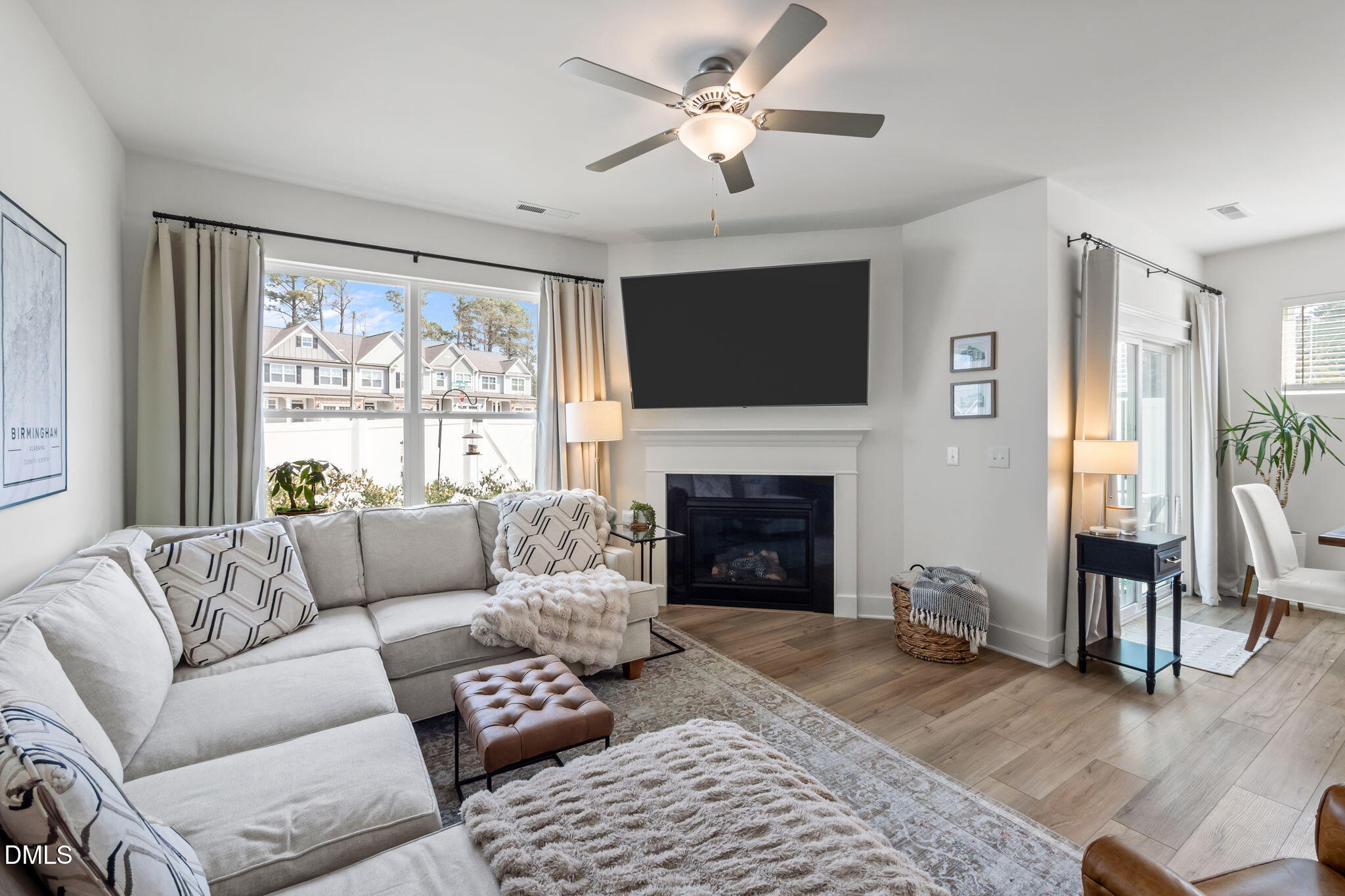 1000 Heartstone Way Durham, NC 27713 - Photo 15 of 43 a living room with furniture a fireplace and a large window