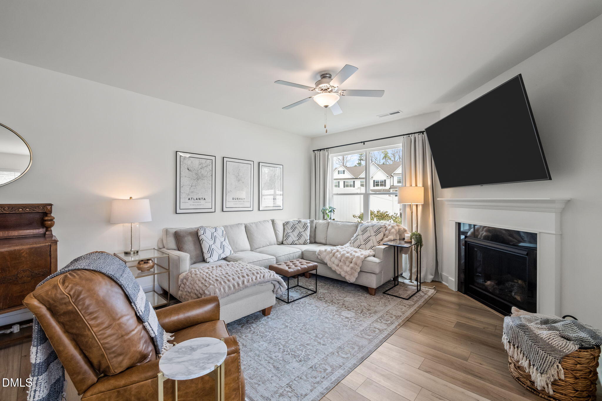 1000 Heartstone Way Durham, NC 27713 - Photo 16 of 43 a living room with furniture fireplace and a flat screen tv