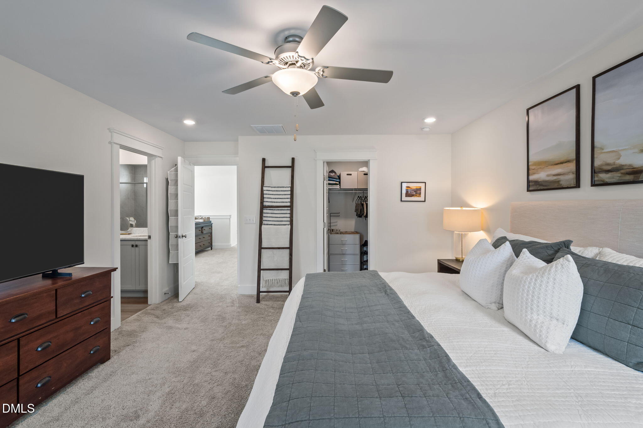 1000 Heartstone Way Durham, NC 27713 - Photo 17 of 43 a spacious bedroom with a bed and a flat screen tv
