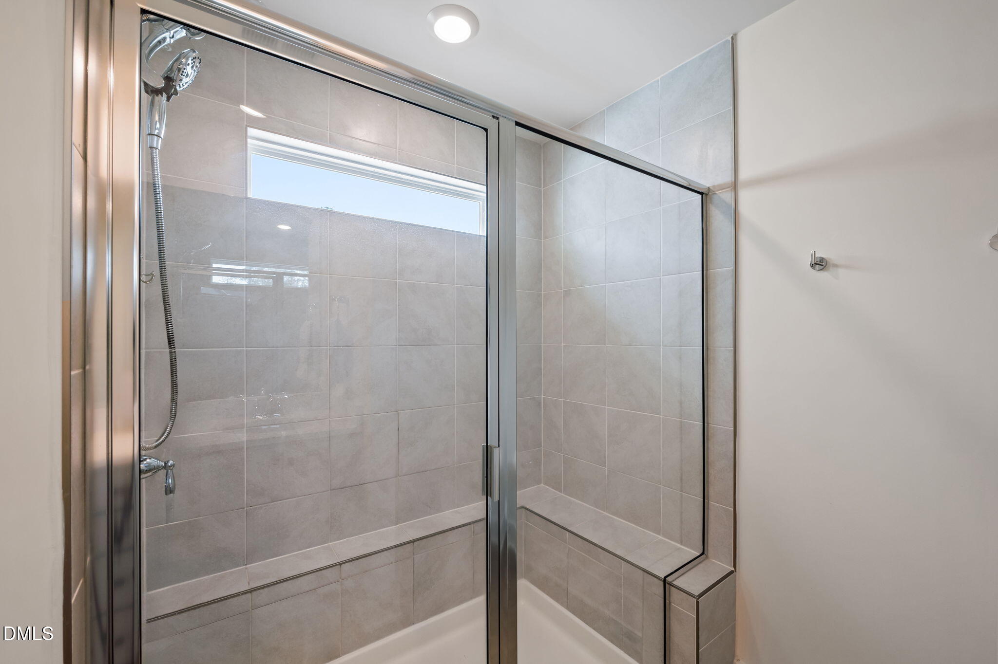 1000 Heartstone Way Durham, NC 27713 - Photo 20 of 43 a bathroom with a glass shower door