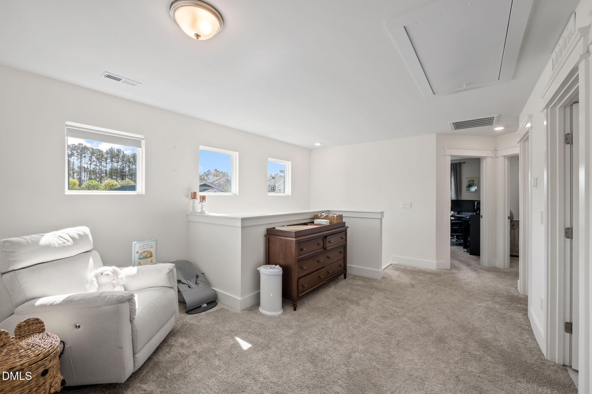 1000 Heartstone Way Durham, NC 27713 - Photo 22 of 43 a living room with furniture and a baby crib