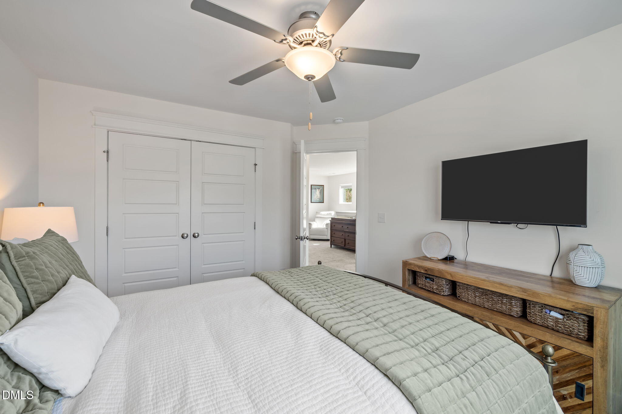 1000 Heartstone Way Durham, NC 27713 - Photo 24 of 43 a bedroom with a bed and a flat screen tv