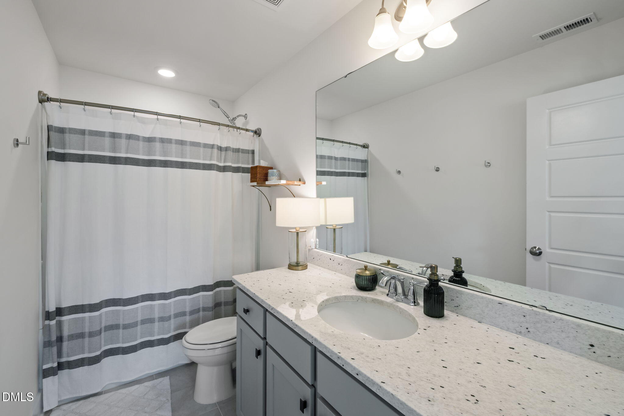 1000 Heartstone Way Durham, NC 27713 - Photo 26 of 43 a bathroom with a sink toilet and shower
