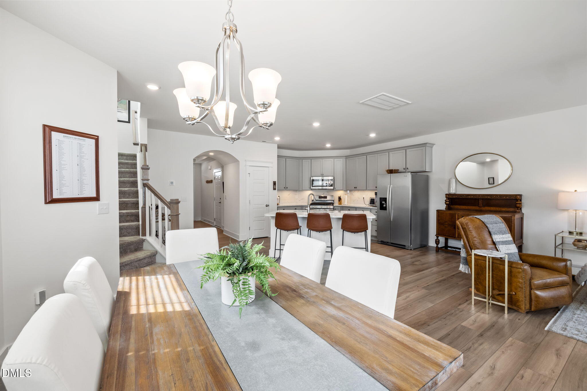1000 Heartstone Way Durham, NC 27713 - Photo 4 of 43 a living room with furniture a chandelier and wooden floor