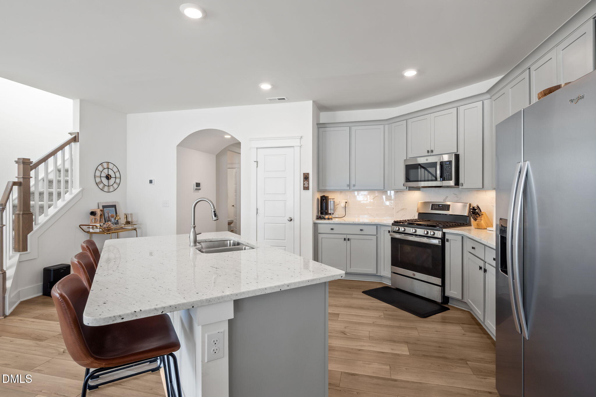 1000 Heartstone Way Durham, NC 27713 - Photo 9 of 43 a kitchen with granite countertop a sink stove and refrigerator