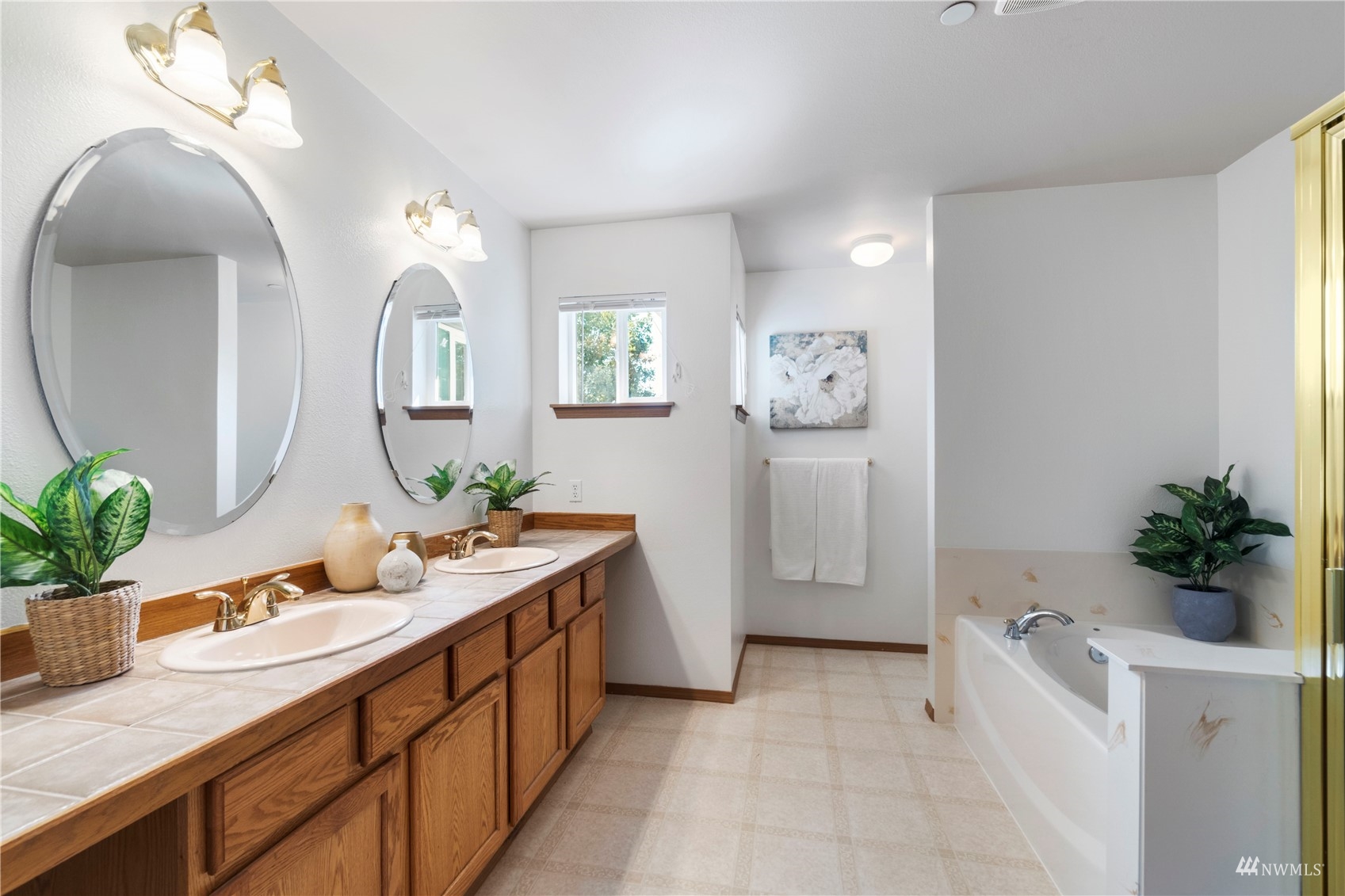 3118 Walker Road DuPont, WA 98327 - Photo 19 of 33 a spacious bathroom with a double vanity sink mirror and bathtub
