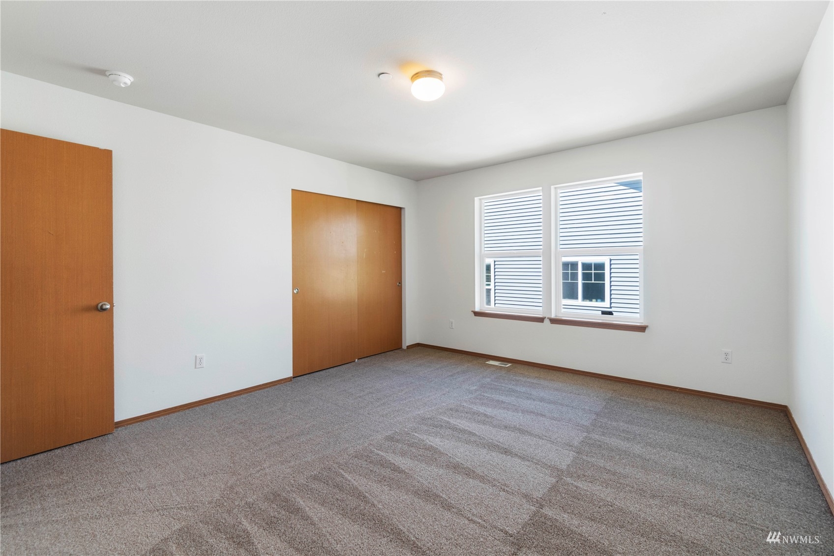 3118 Walker Road DuPont, WA 98327 - Photo 23 of 33 an empty room with windows & cabinet