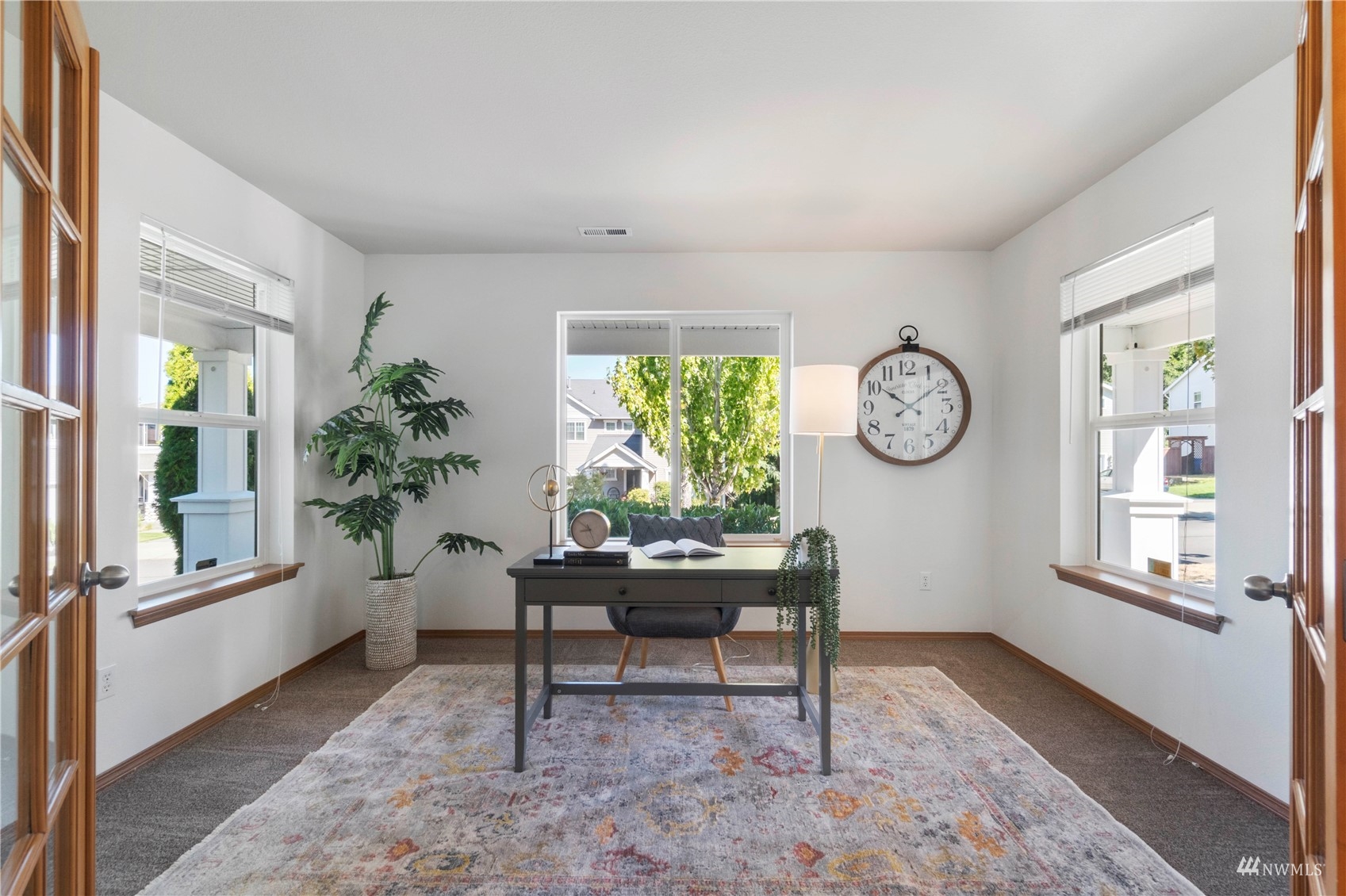 3118 Walker Road DuPont, WA 98327 - Photo 3 of 33 a living room with furniture a window and a potted plant