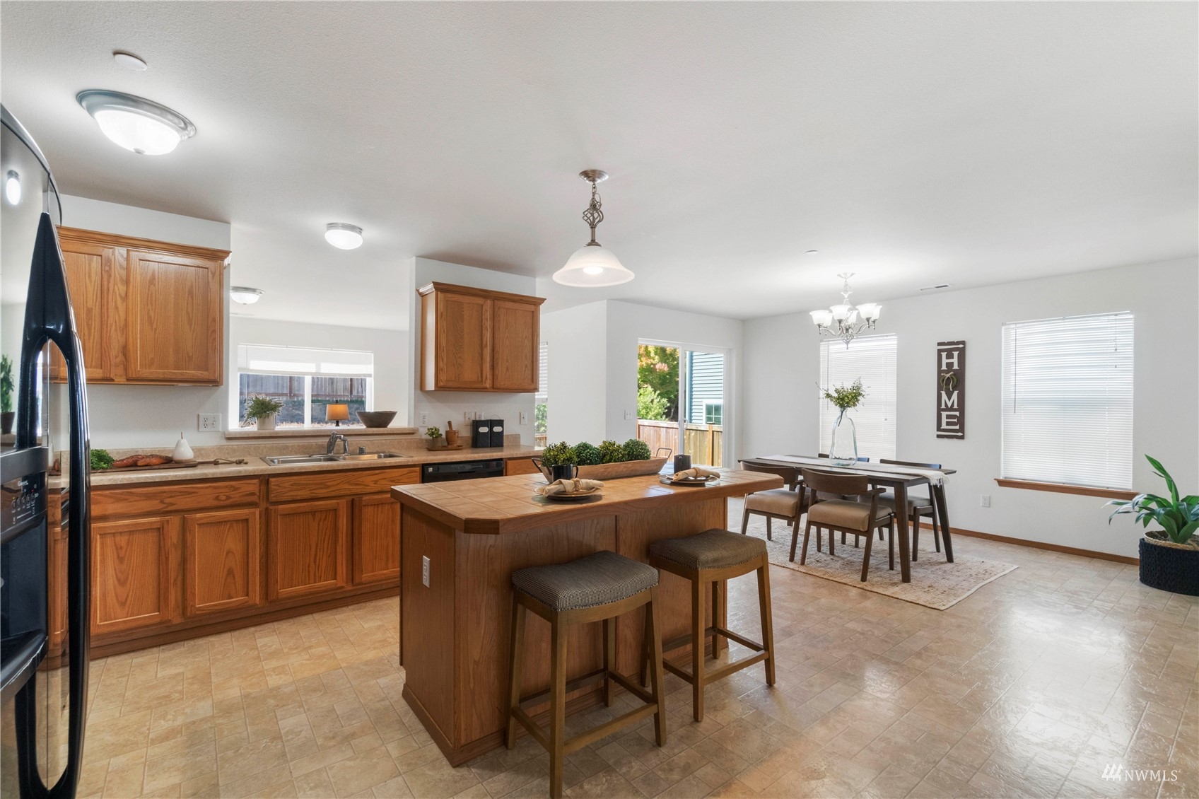 3118 Walker Road DuPont, WA 98327 - Photo 6 of 33 a kitchen with lots of counter top space and dining table