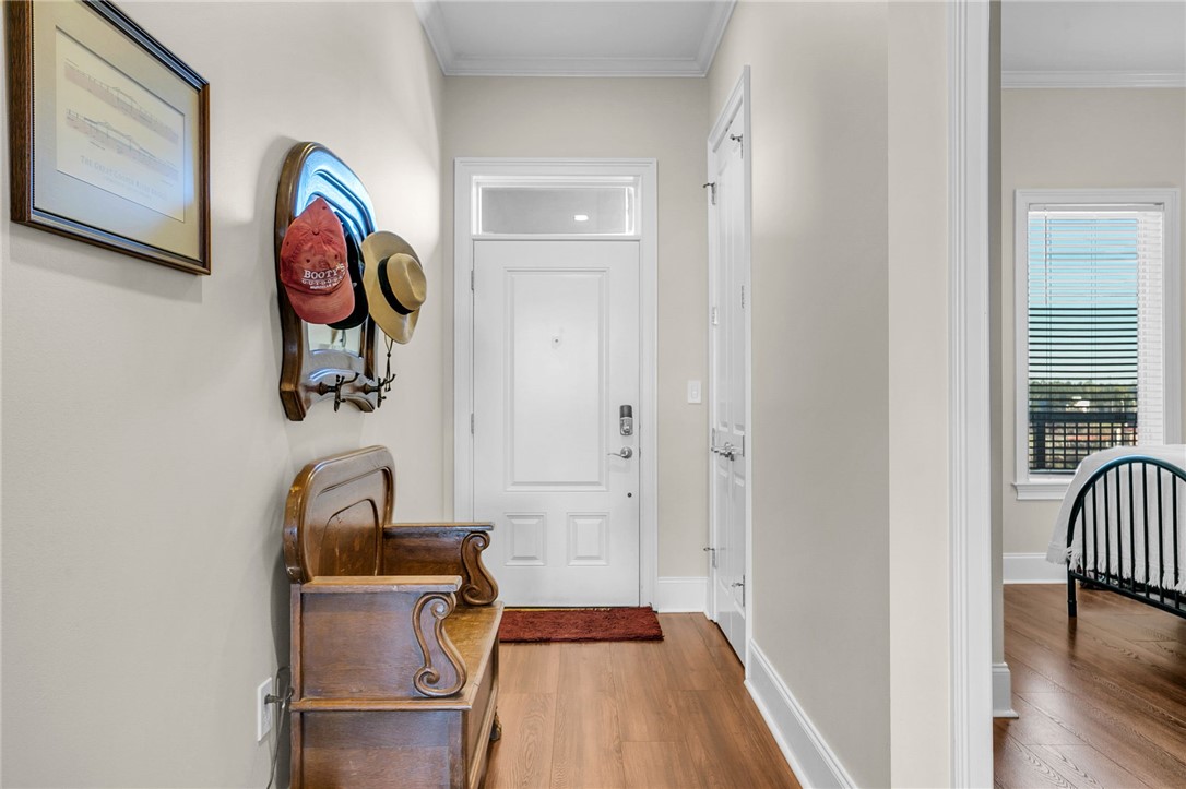 703 Watermarke Lane Anderson, SC 29625 - Photo 4 of 49 Welcome home to this inviting entryway, boasting warm wood floors and ample natural light.