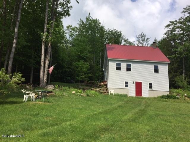 2810 Howe Pond Road Readsboro, VT 05350 - Photo 1 of 29 a view of a house with a yard and sitting area
