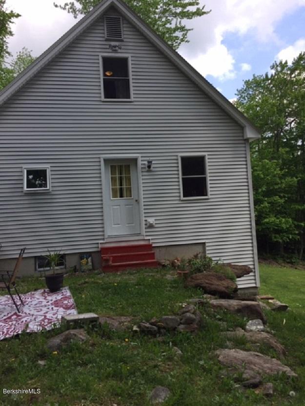 2810 Howe Pond Road Readsboro, VT 05350 - Photo 2 of 29 a backyard of a house with lots of green space