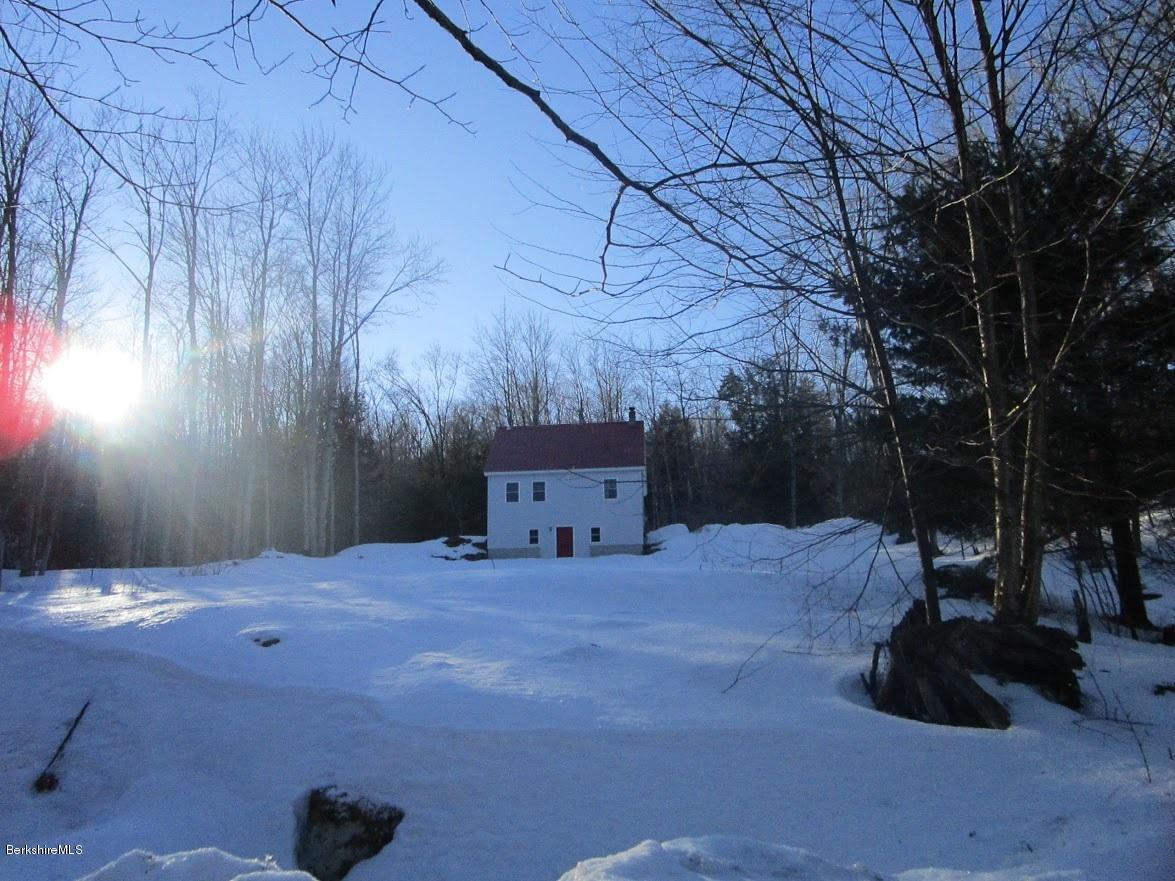 2810 Howe Pond Road Readsboro, VT 05350 - Photo 12 of 29 a backyard of a house with table and chairs