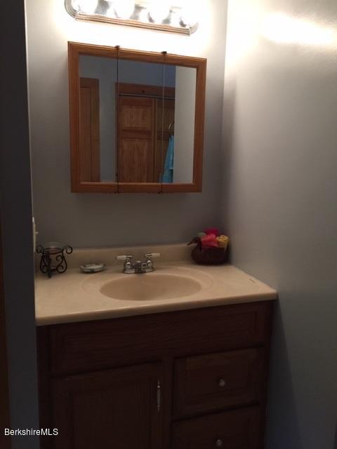 2810 Howe Pond Road Readsboro, VT 05350 - Photo 16 of 29 a bathroom with a sink vanity and mirror