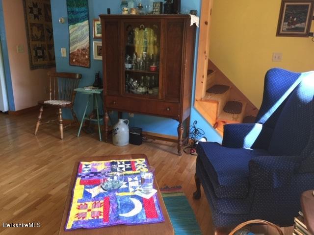 2810 Howe Pond Road Readsboro, VT 05350 - Photo 20 of 29 a living room with furniture and a wooden floor