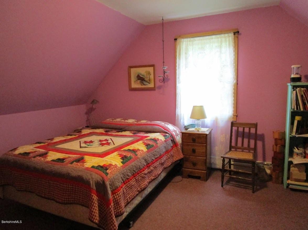 2810 Howe Pond Road Readsboro, VT 05350 - Photo 26 of 29 a bedroom with a bed chair and a closet