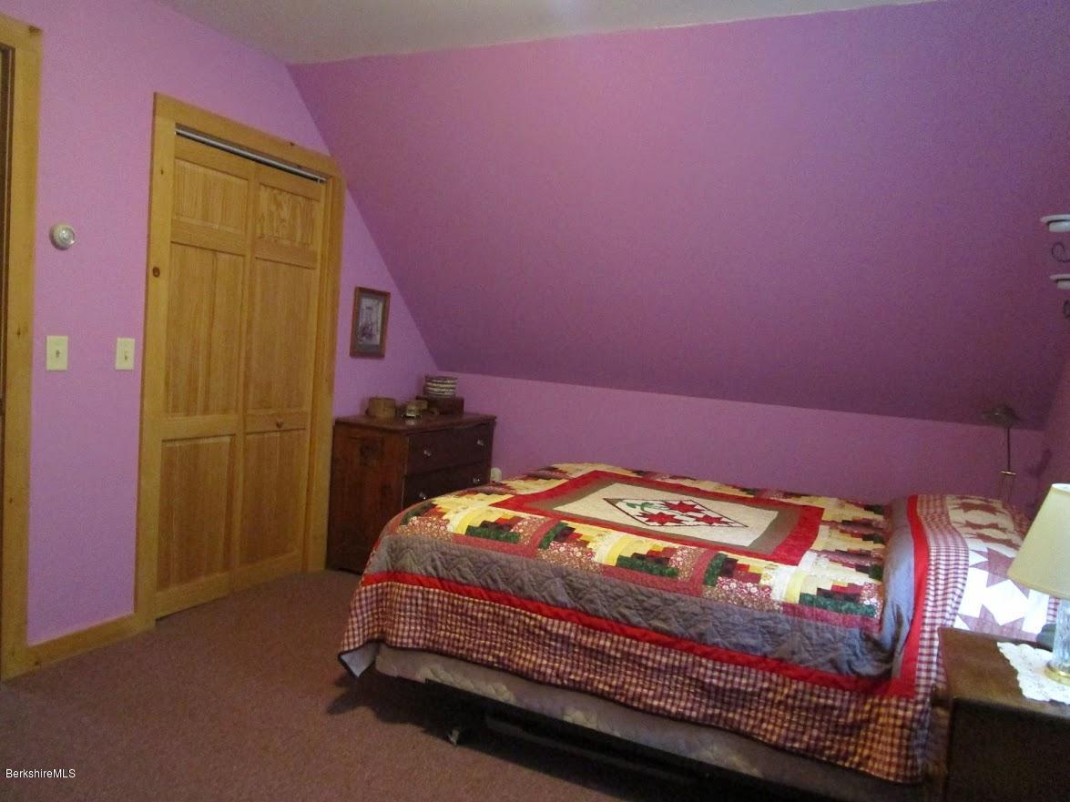 2810 Howe Pond Road Readsboro, VT 05350 - Photo 27 of 29 a bed room with a bed and a dresser