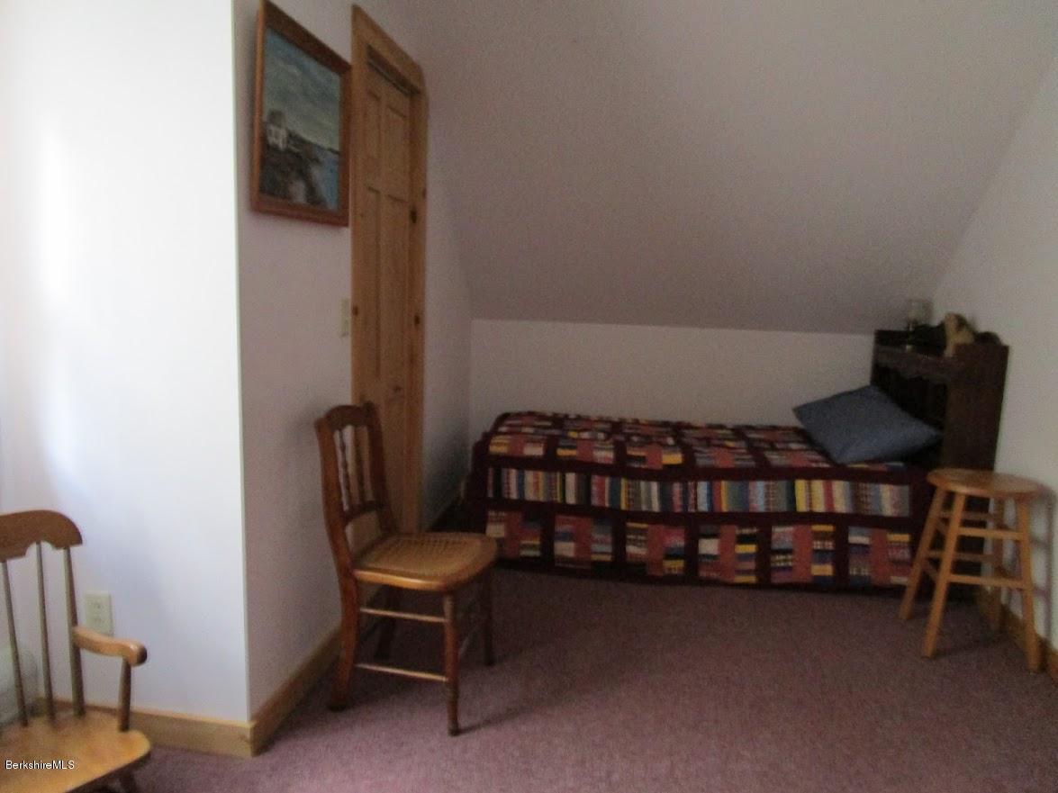 2810 Howe Pond Road Readsboro, VT 05350 - Photo 28 of 29 a balcony with a table and chairs