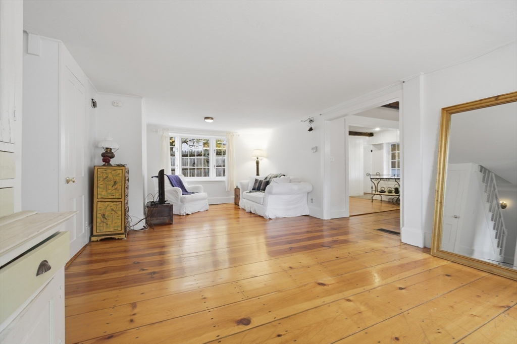 36 Concord Road Sudbury, MA 01776 - Photo 11 of 30 a living room with furniture and a wooden floor
