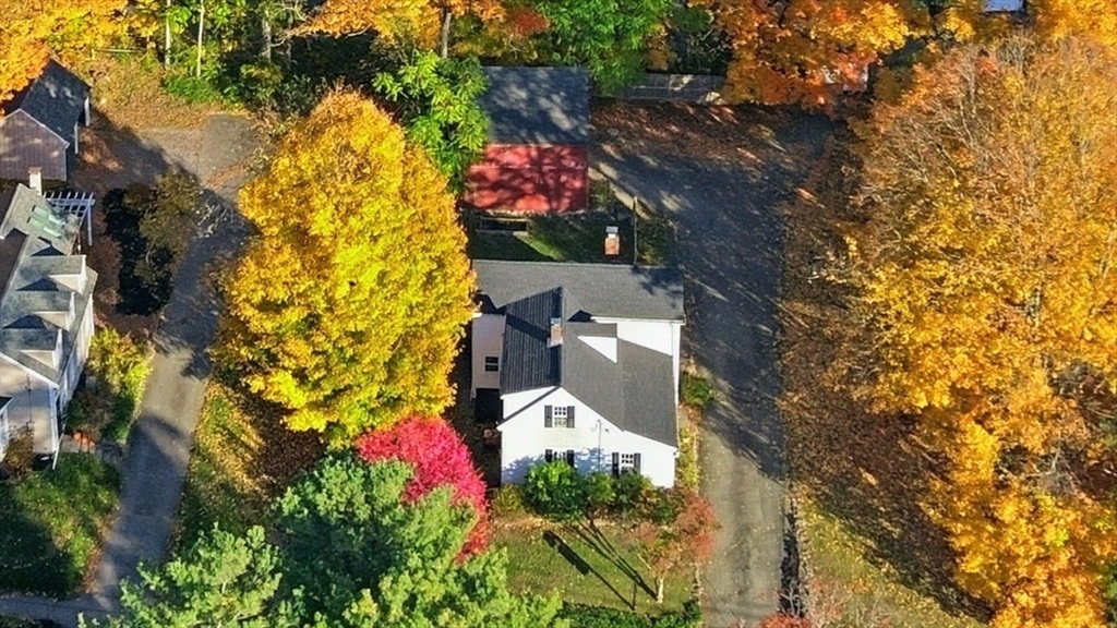36 Concord Road Sudbury, MA 01776 - Photo 2 of 30 a aerial view of a house with a yard and large trees