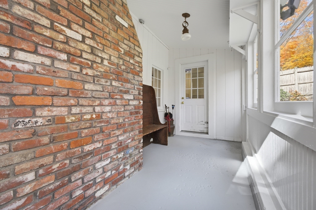 36 Concord Road Sudbury, MA 01776 - Photo 22 of 30 a view of entryway with window and wooden floor