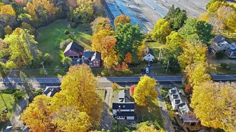 a front view of a house with swimming pool and porch