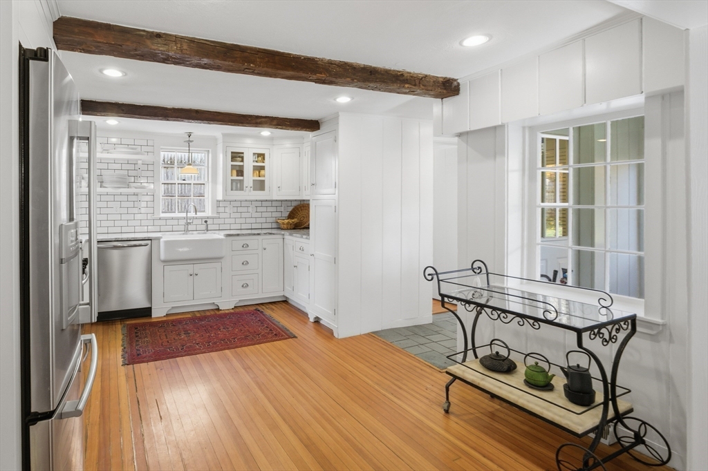 36 Concord Road Sudbury, MA 01776 - Photo 5 of 30 a view of a kitchen with a sink and cabinets