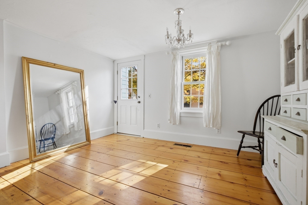 36 Concord Road Sudbury, MA 01776 - Photo 9 of 30 a view of livingroom with hardwood floor and hallway