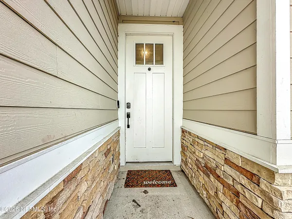 a view of car garage with wooden floor