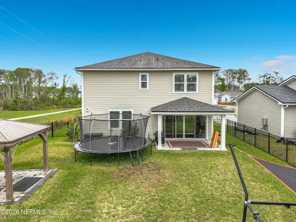 swimming pool with yard barbeque oven and outdoor seating