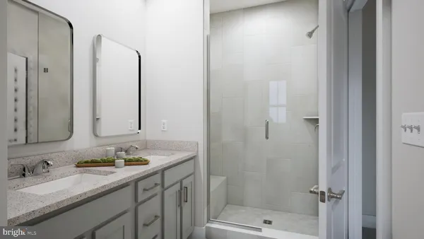 a bathroom with a granite countertop sink mirror and double