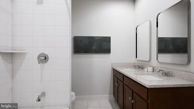 a bathroom with a sink a toilet and mirror