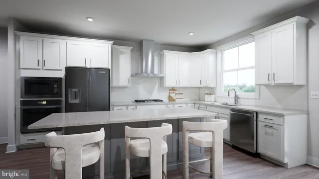 a kitchen with refrigerator a stove a sink and a window