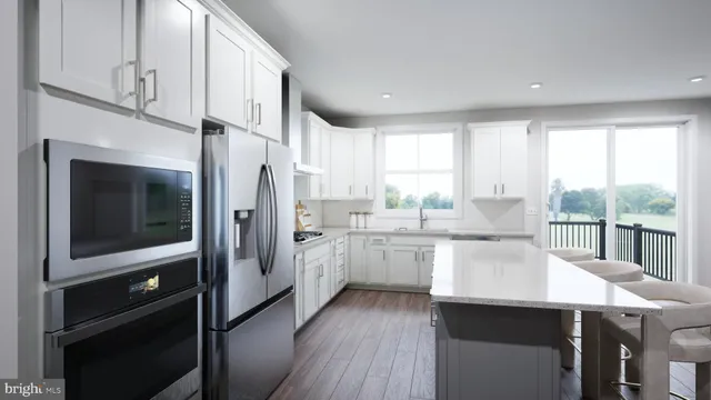 a kitchen with counter top space cabinets and stainless steel appliances