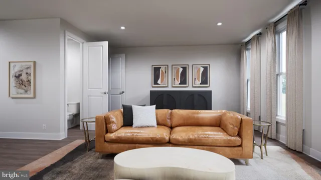 a living room with furniture and a painting