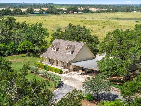 a aerial view of a house with a lake view