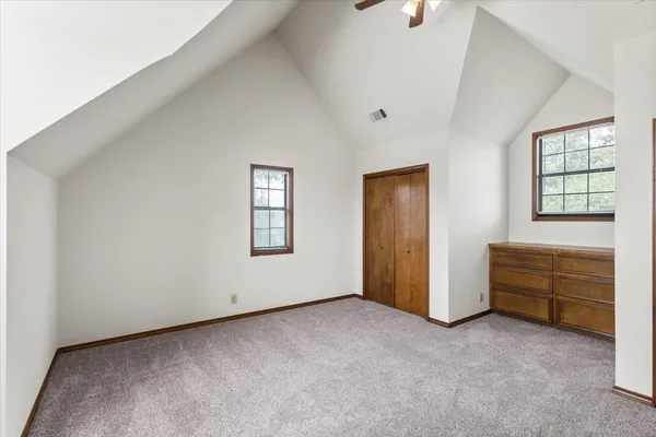 a view of room with cabinet and windows