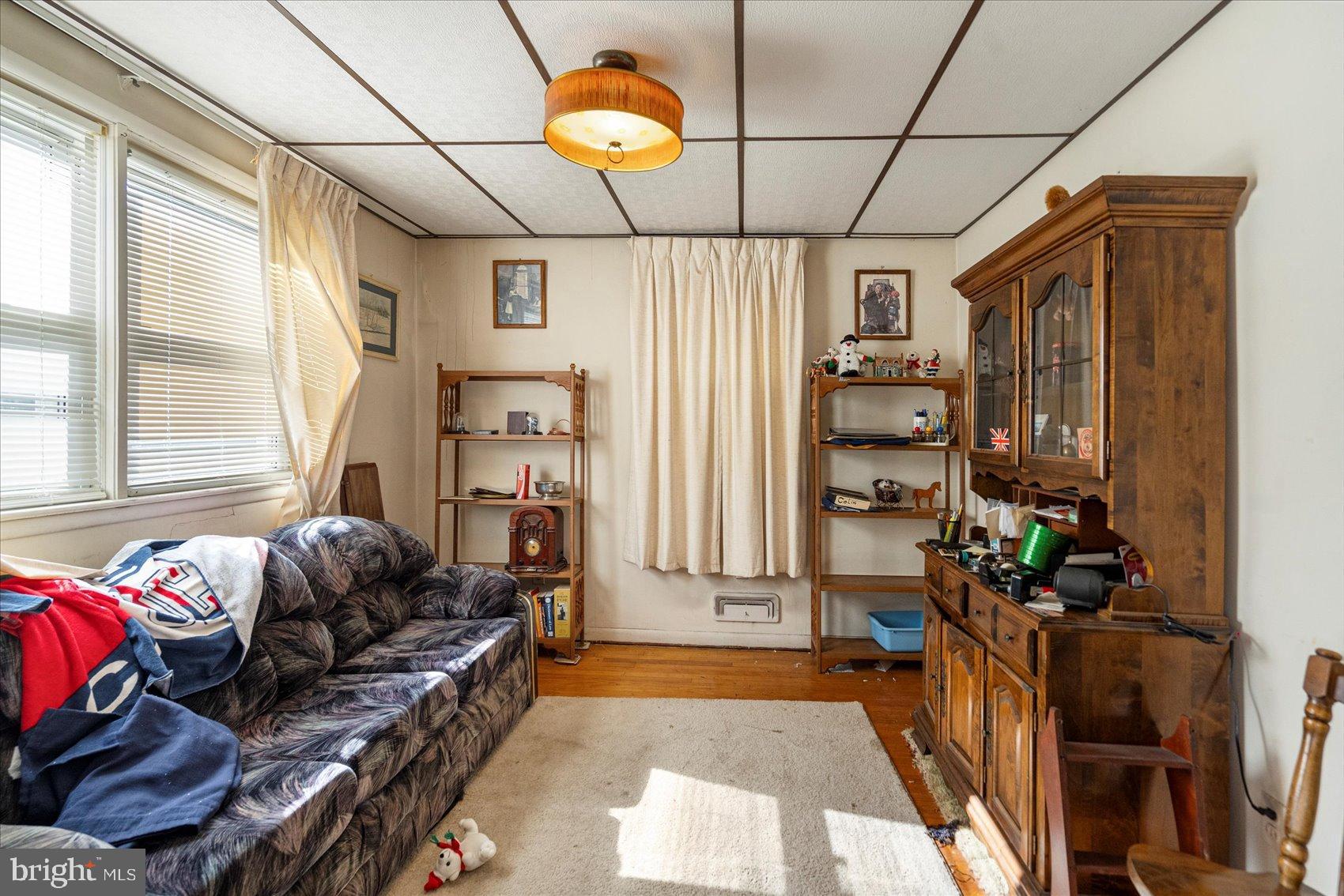 8368 Old Philadelphia Road Baltimore, MD 21237 - Photo 12 of 29 a living room with furniture a flat screen tv and a window