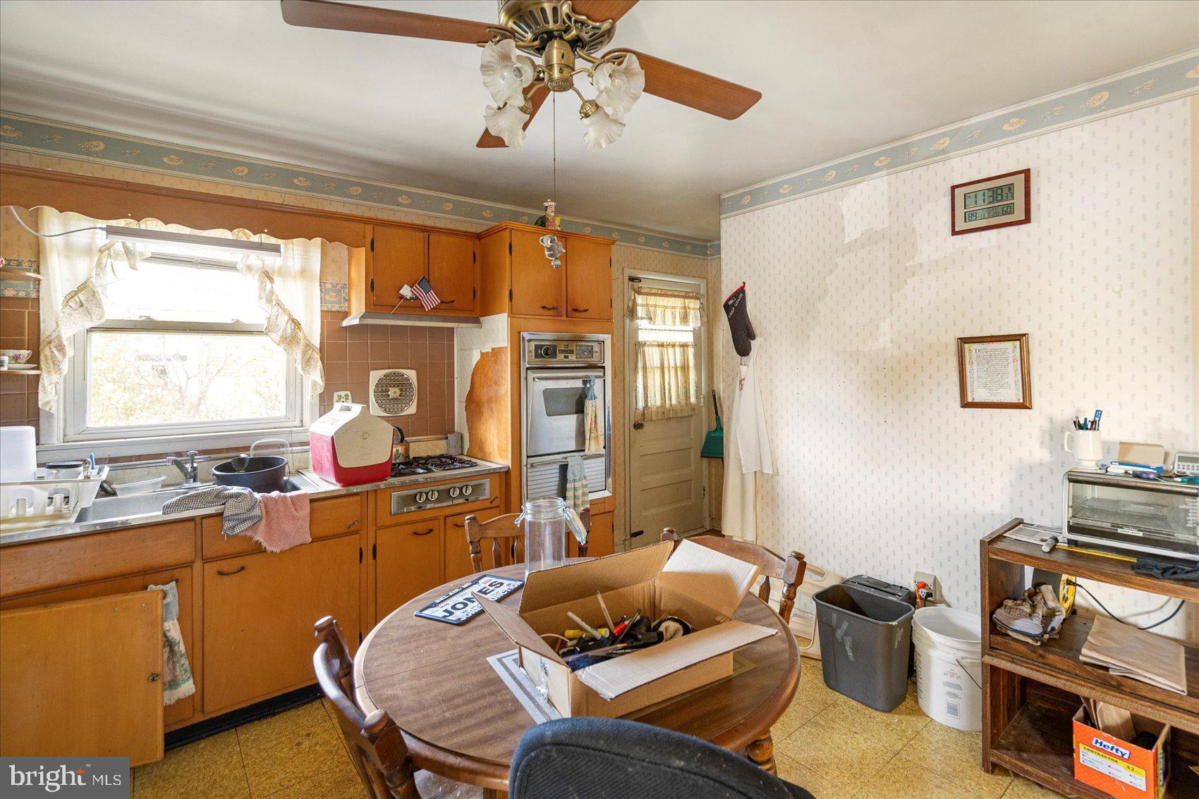 8368 Old Philadelphia Road Baltimore, MD 21237 - Photo 15 of 29 a bedroom with a bed and wooden floor