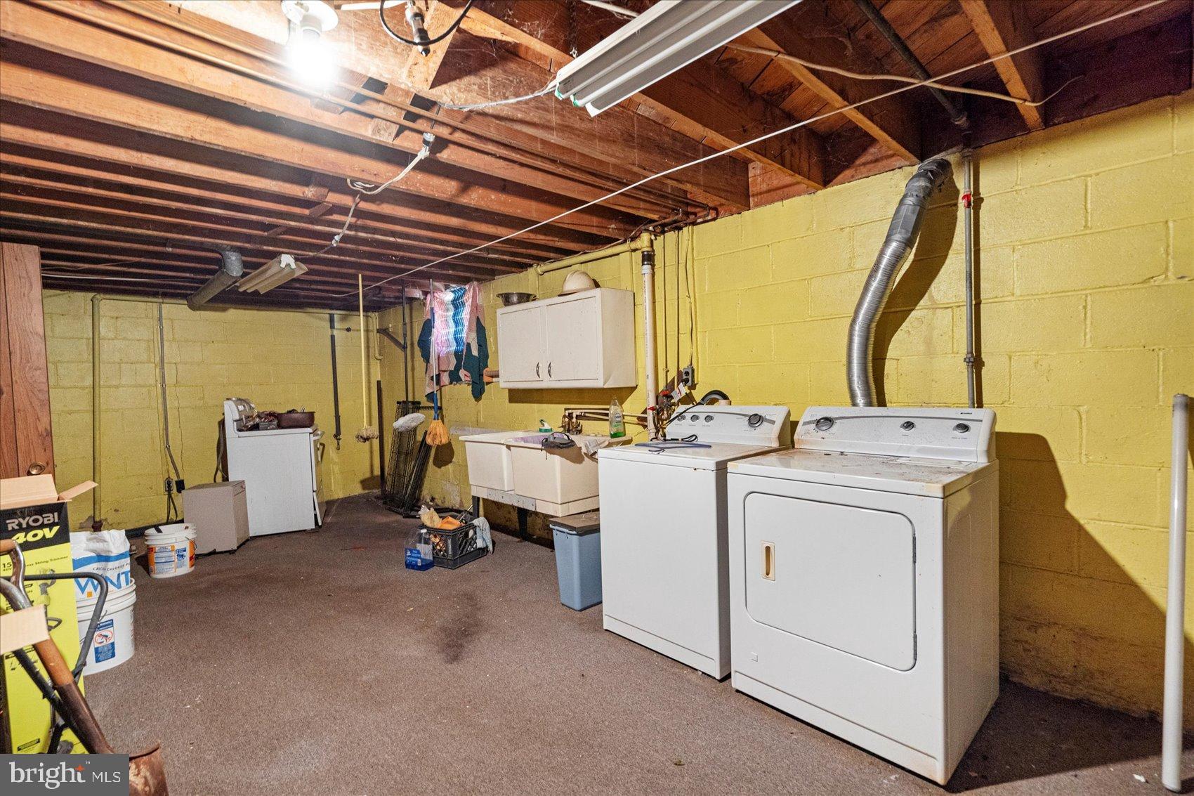 8368 Old Philadelphia Road Baltimore, MD 21237 - Photo 26 of 29 a view of storage and utility room with washer and dryer