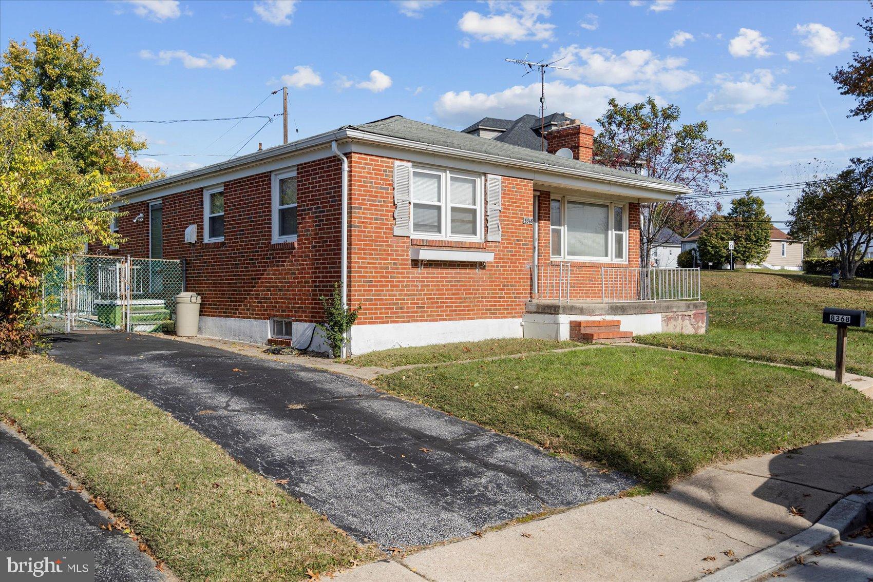 8368 Old Philadelphia Road Baltimore, MD 21237 - Photo 3 of 29 a front view of a house with a yard